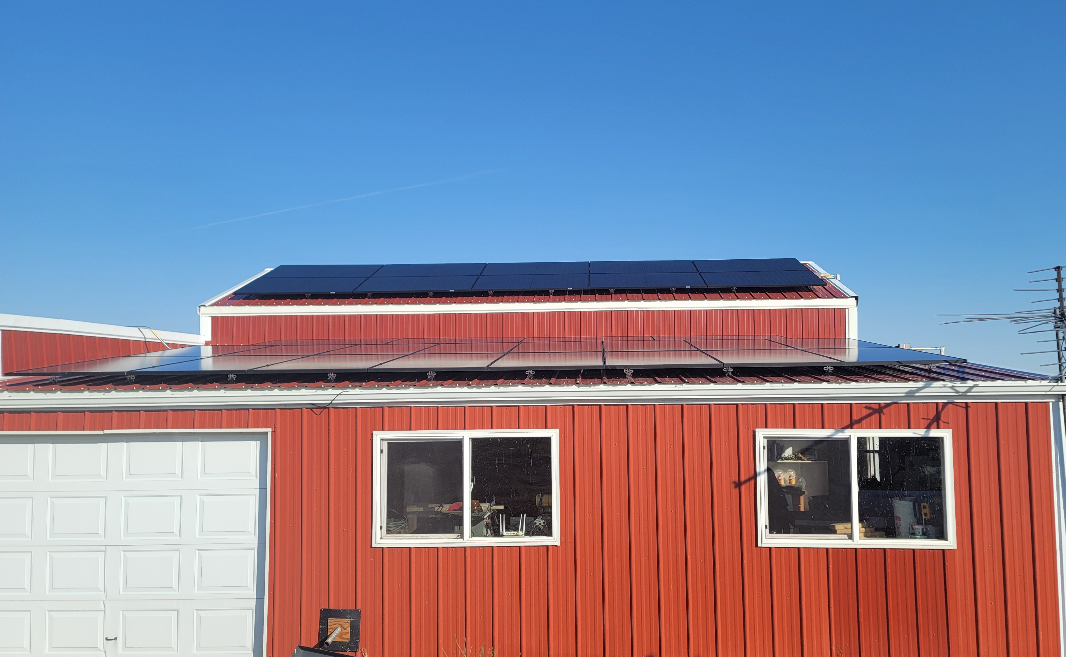 Solar panels installed on a red building