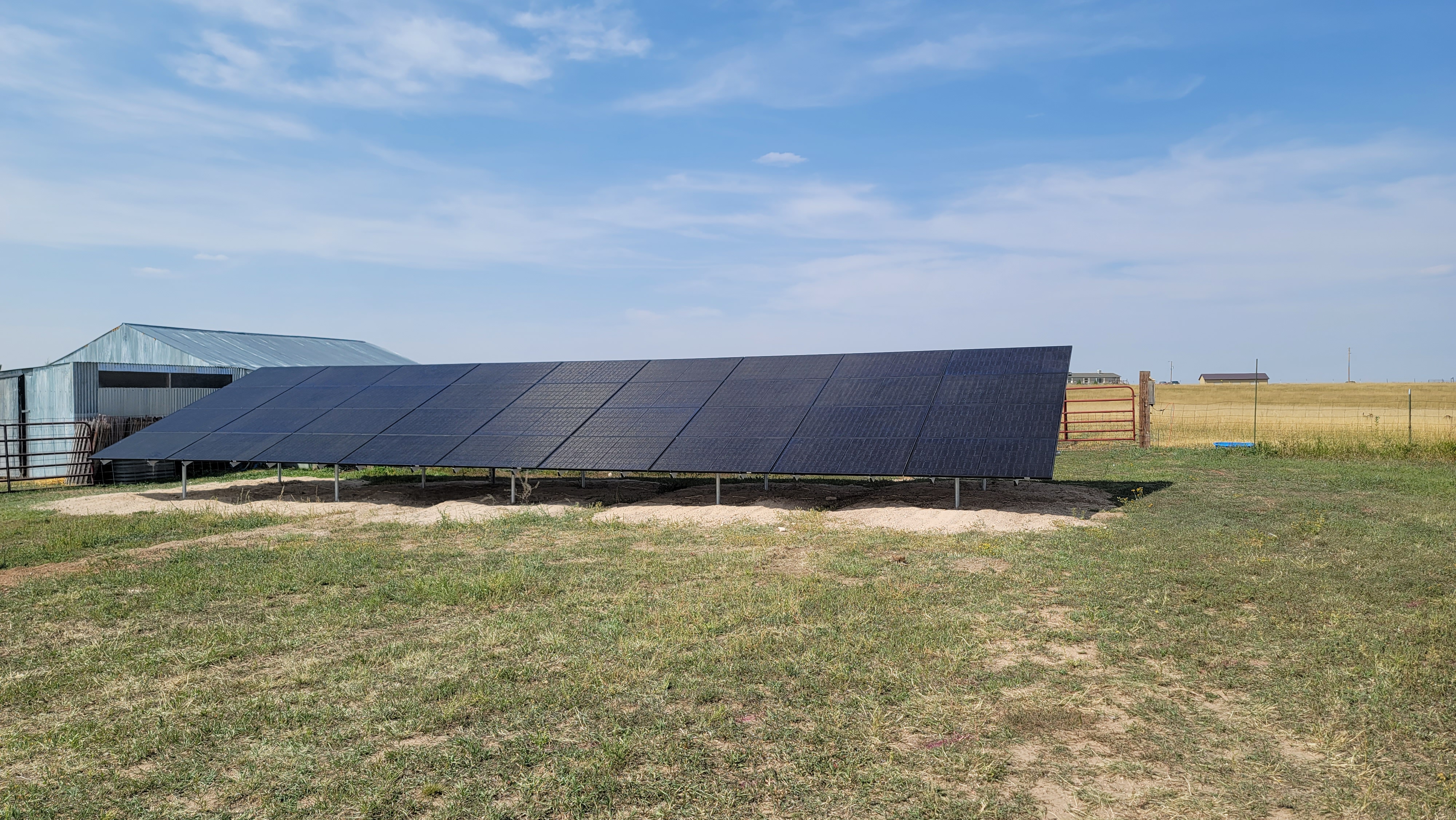 Solar panels installed on a farm backdrop
