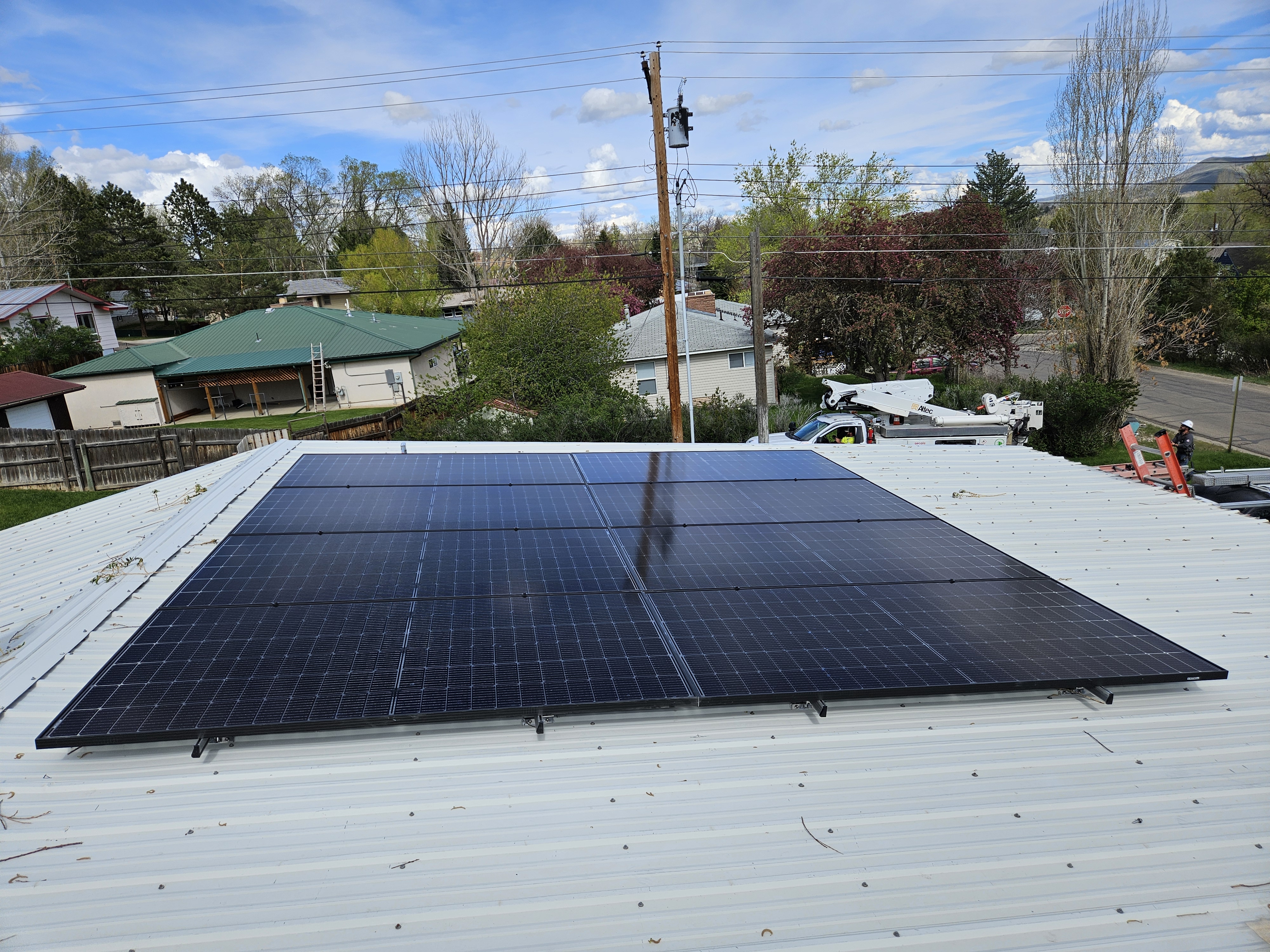 Solar panels installed on a white roof